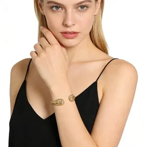 Lion Bangle, gold-plated steel, gold, another view